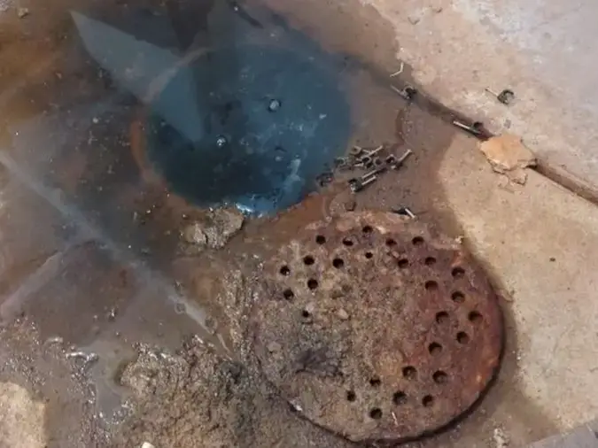 Basement floor drain backup that may indicate a main sewer line issue