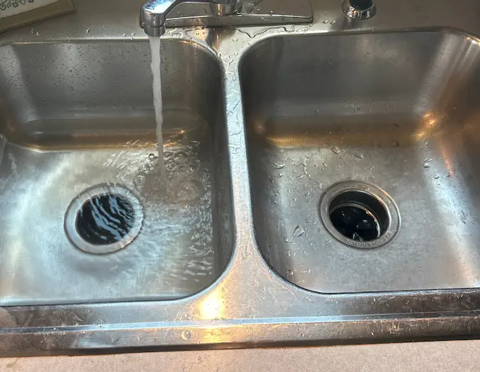 Slow kitchen sink drain backing up in a Wichita area home