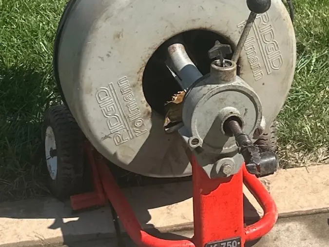 Drain cleaning machine used for clogged drain service