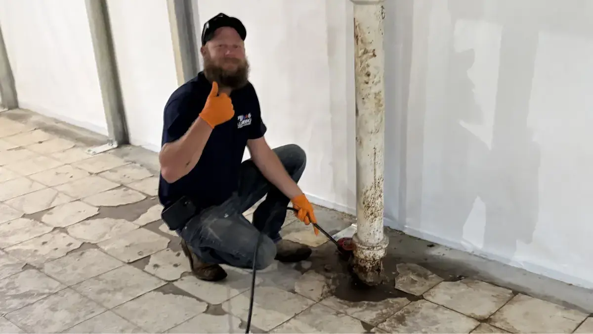 PD Plumbing technician hydro jetting an accessible main sewer line in Wichita