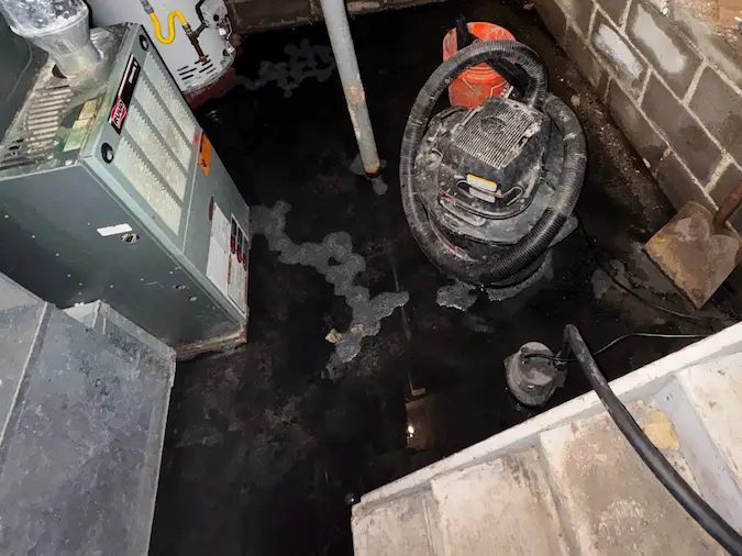 Standing water in basement before sump pump and drainage inspection