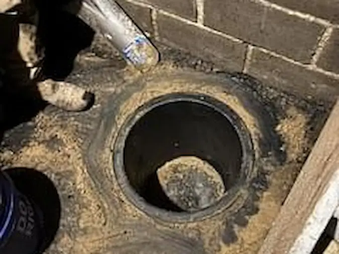 Open sump basin after concrete was opened for sump pump installation