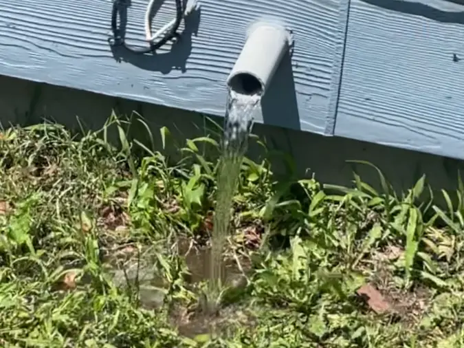 Sump pump discharge line moving water away from the home