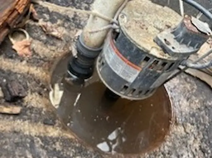 Water around a sump pump basin during a basement water problem