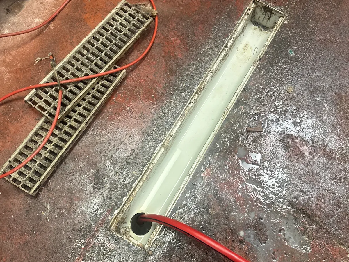 Commercial floor drain cleaning with professional drain equipment