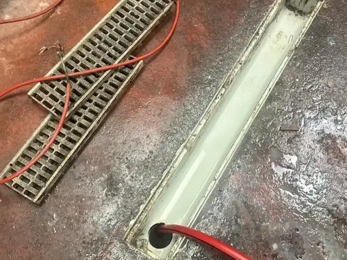 Commercial floor drain cleaning with professional drain equipment