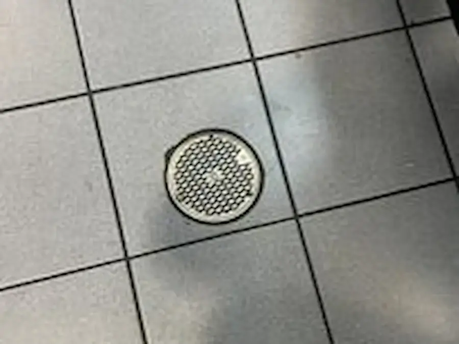 Floor drain backing up in a tiled floor