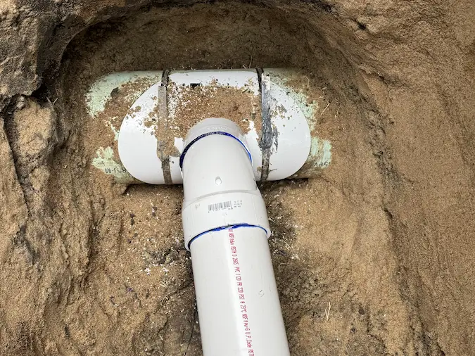 Final PVC sewer line connection completed during replacement