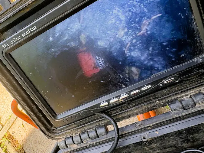 Sewer camera monitor showing the inside of a sewer line during inspection