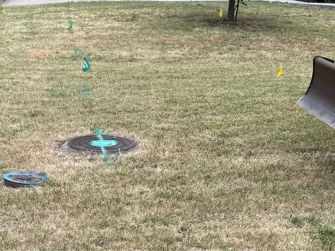 Technician locating a long sewer route before trenchless replacement