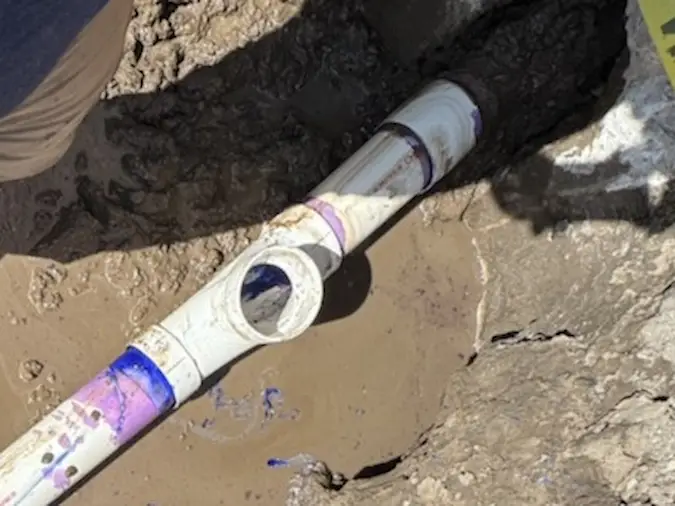Final sewer line connection completed after trenchless replacement