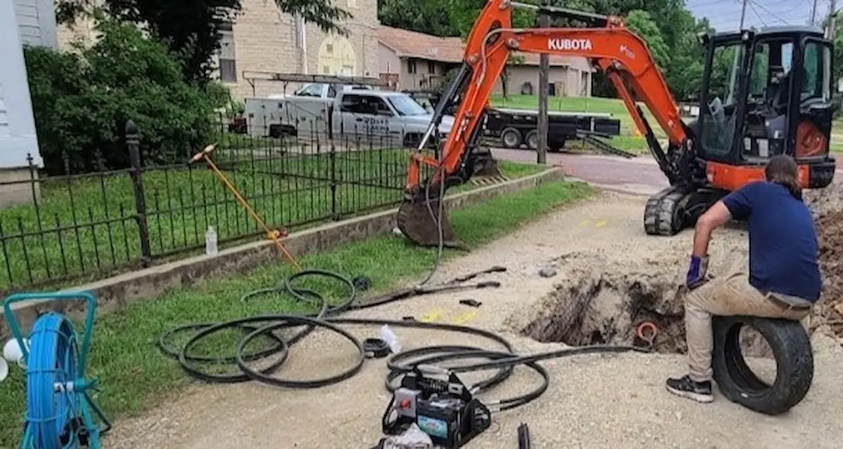 Trenchless sewer replacement work across a residential yard