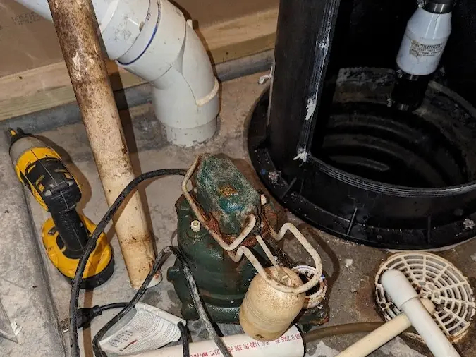 Old sump pump removed during replacement