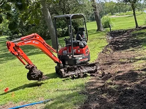 Sump pump discharge line burial work by PD Plumbing