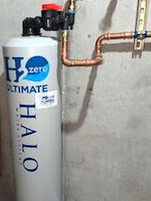 HALO water-treatment tank with visible copper plumbing connections