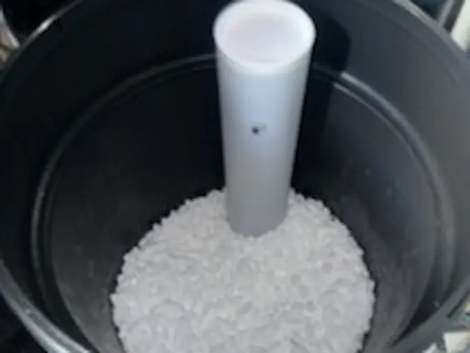 Salt pellets inside a water softener brine tank