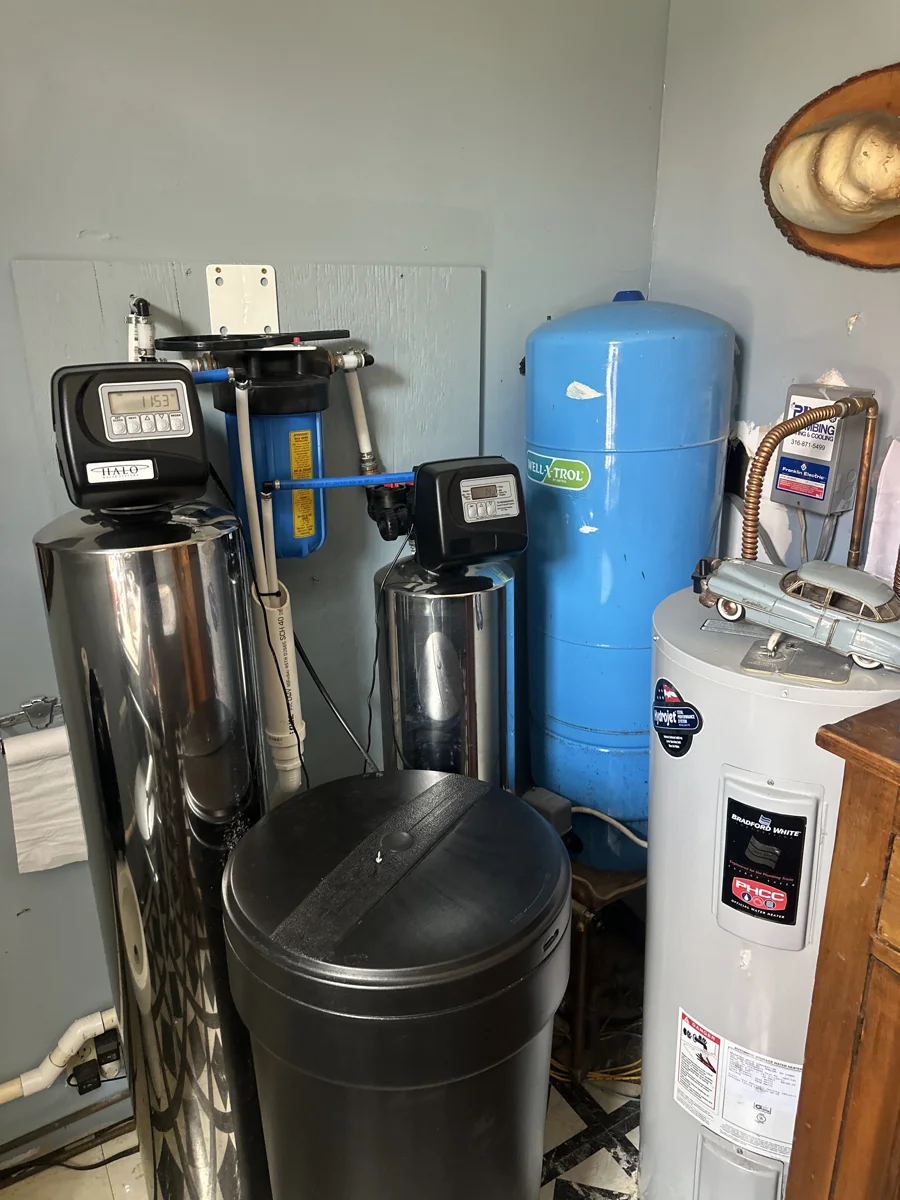 Installed whole-home filtration and water-treatment equipment in a utility area