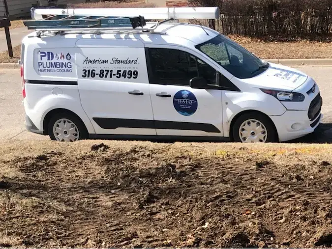 PD Plumbing service van at a plumbing job