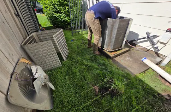 HVAC technician changing furnace filter Wichita