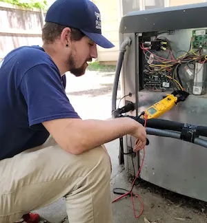 Technician testing HVAC system Wichita KS